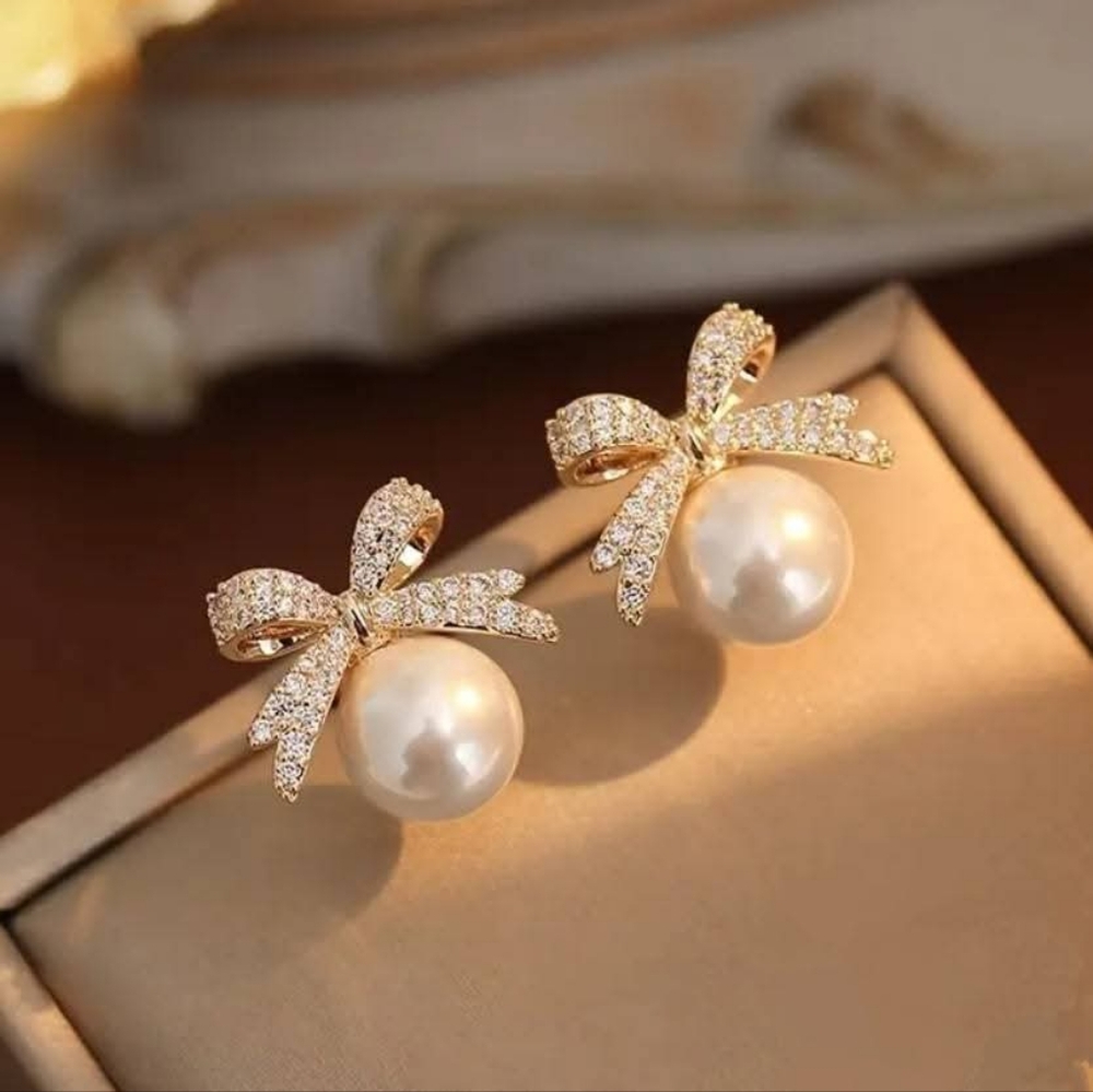 Elegant Pearl and Gold Bow Crystal Earrings